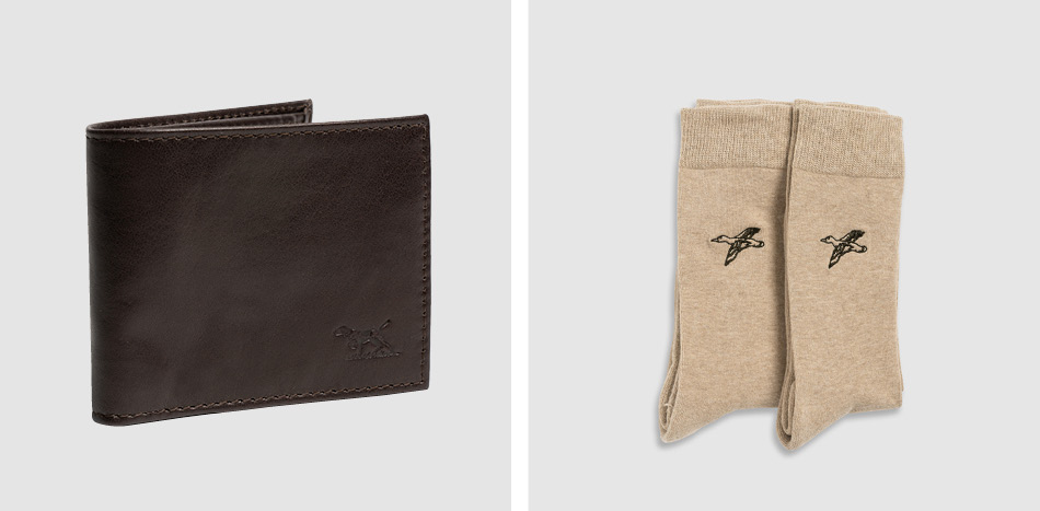 Men's brown leather wallet and a pair of beige men's socks with mallard ducks embroidery.