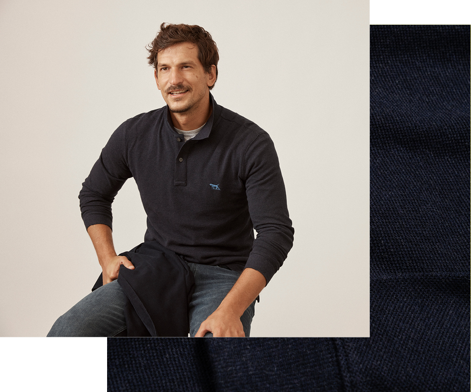 Man sitting on chair wearing dark cotton polo