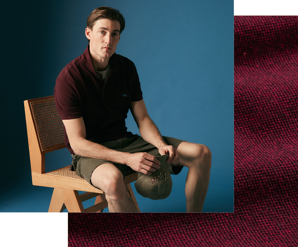 Man sitting on chair wearing dark cotton polo
