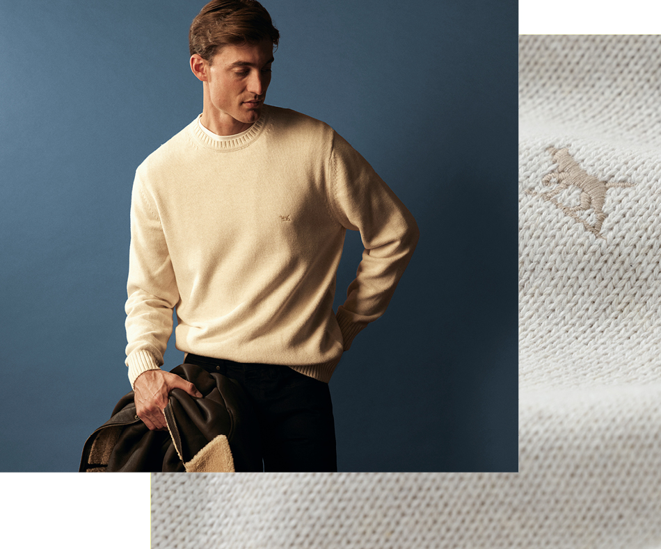 Man wearing a lightweight cream colour knit.