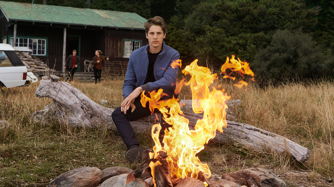 Rodd & Gunn's campaign shoot next to a fire.