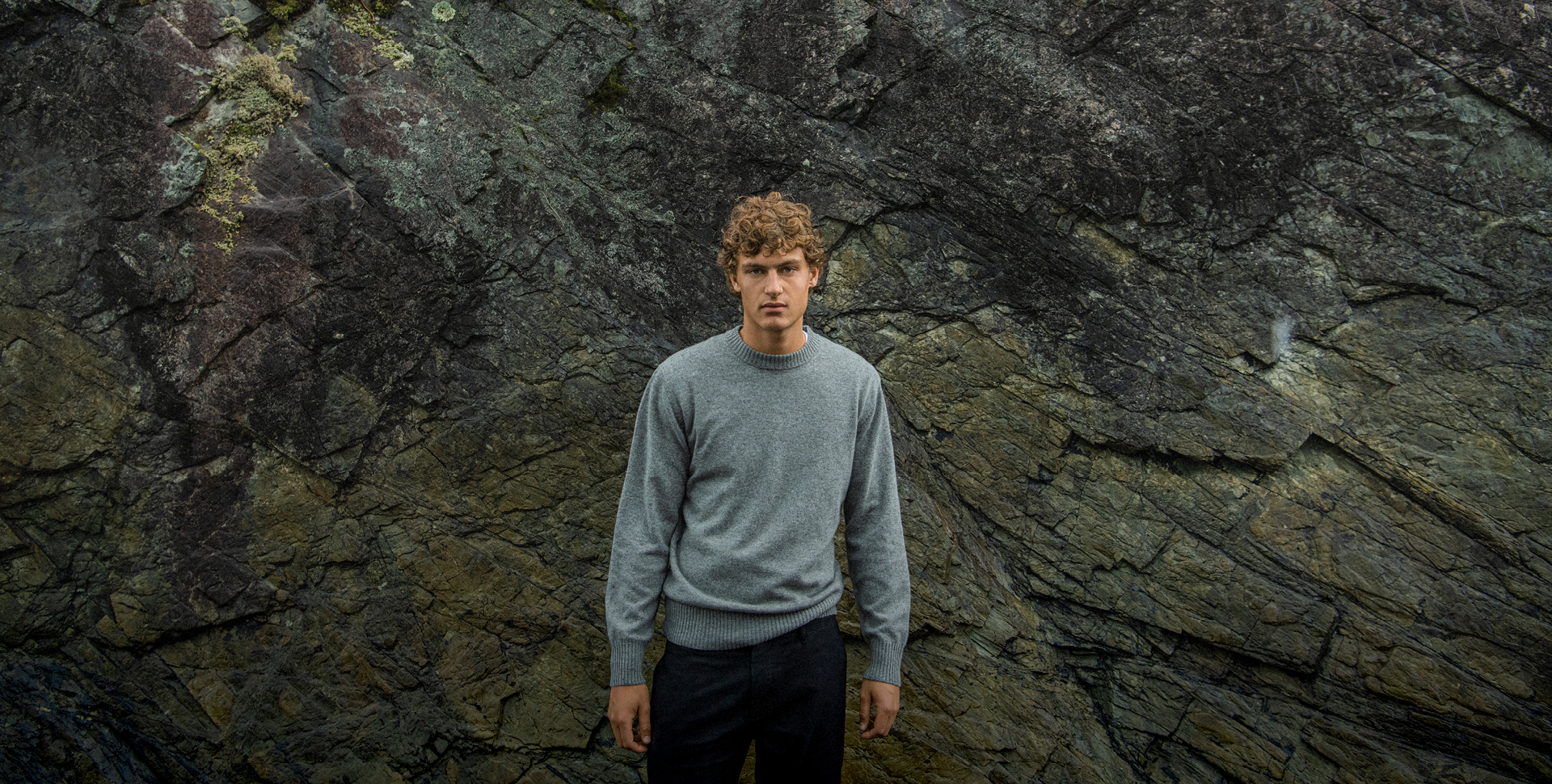 A man in a refined wool knit, exuding understated luxury and warmth