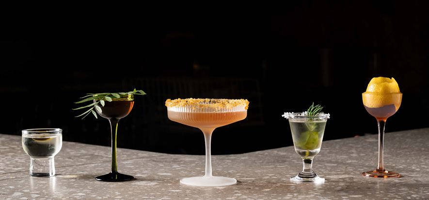 Book miniBAR A picture of different coctails in a glass