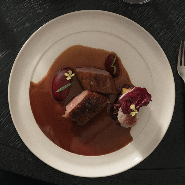 A beautifully plated gourmet dish with vibrant colors and elegant presentation.