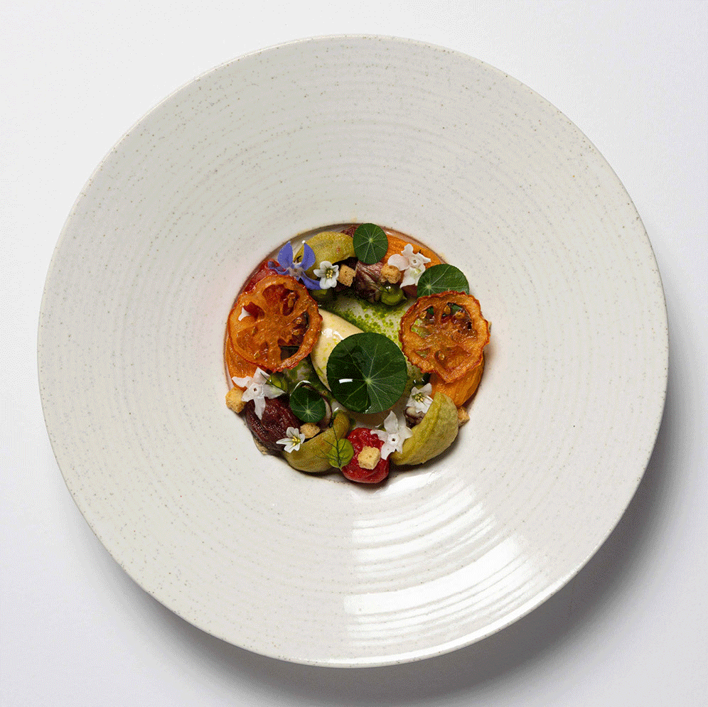 A beautifully plated gourmet dish with vibrant colors and elegant presentation.